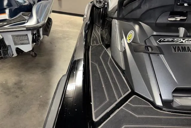 Slide: The Image of 2020 Yamaha WaveRunner FX Cruiser SVHO, sleek black design, in a garage setting. - 12