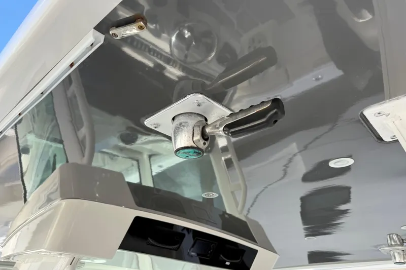 Slide: The Image of 2018 HCB 39 Speciale boat interior with mounted handle and reflective surfaces. - 12