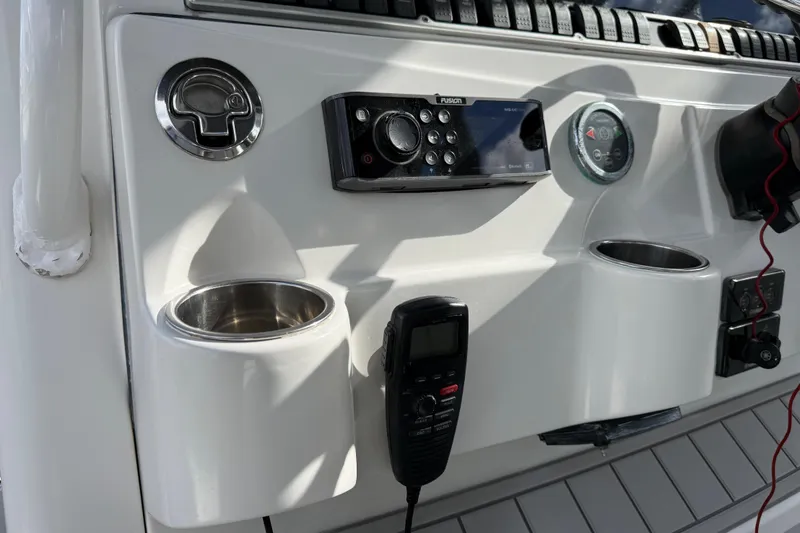 Slide: The Image of Control panel of 2018 HCB 39 Speciale boat with radio and cup holders. - 13