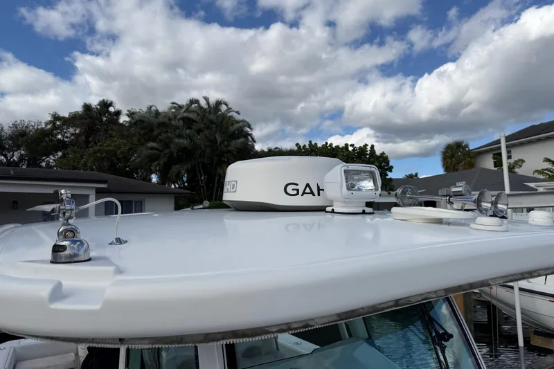 Slide: The Image of 2018 HCB 39 Speciale boat roof with radar and spotlight under cloudy sky. - 17
