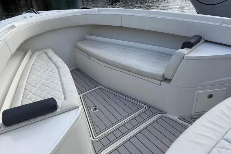 Slide: The Image of Interior of 2018 HCB 39 Speciale boat with white cushioned seating. - 18