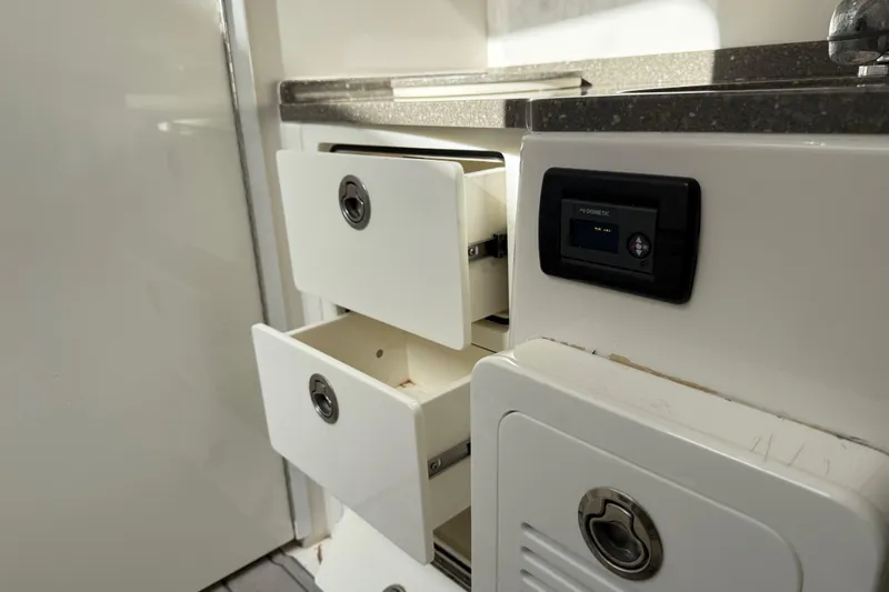 Slide: The Image of Interior of 2018 HCB 39 Speciale with open drawers and control panel. - 27