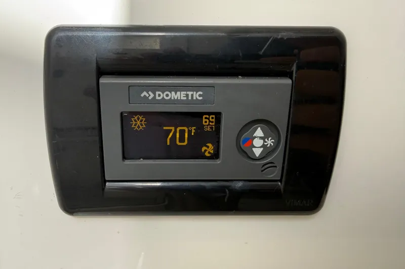 Slide: The Image of Dometic thermostat display set to 70°F in 2018 HCB 39 Speciale. - 29