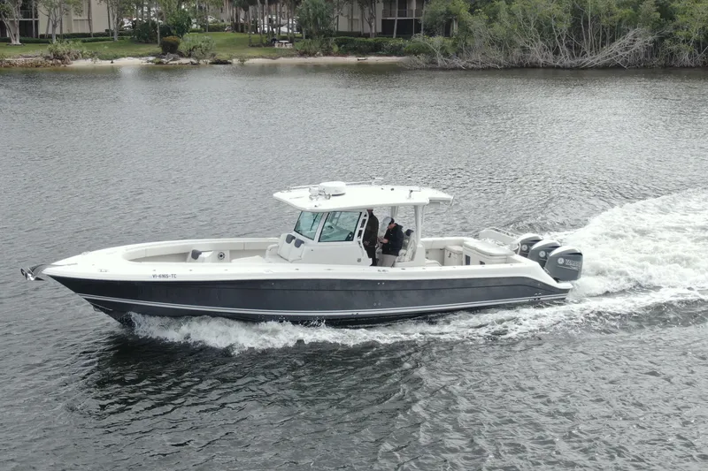 Slide: The Image of 2018 HCB 39 Speciale boat cruising on a calm waterway. - 40