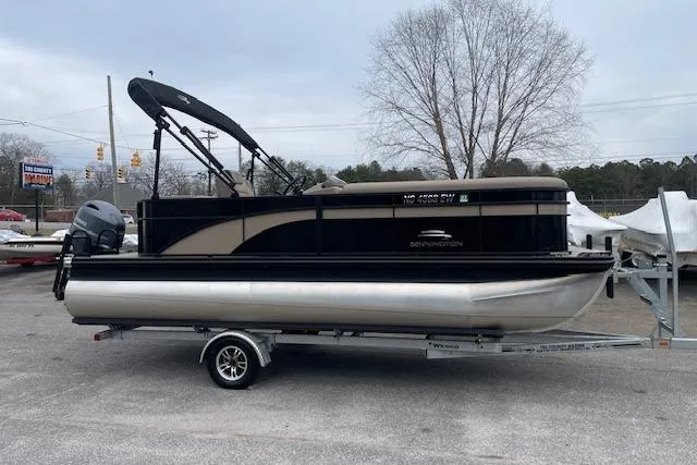Slide: The Image of 2022 Bennington 20 SLX pontoon boat on trailer, parked outdoors. - 2