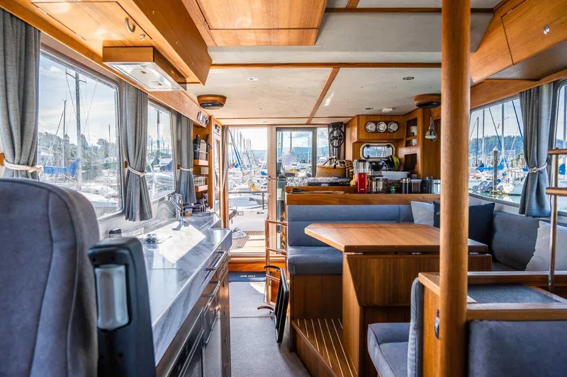 Slide: The Image of Luxurious interior of 2025 Targa 46 yacht with modern wood finishes and spacious seating. - 13