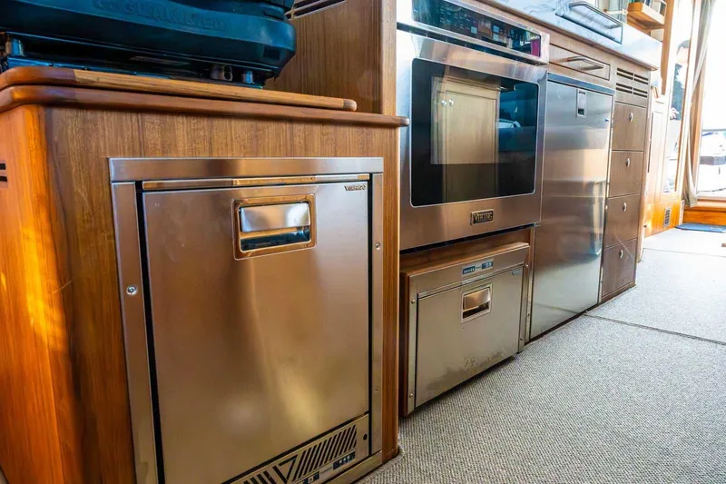 Slide: The Image of Modern kitchen appliances in a 2025 Targa 46 yacht interior. - 18