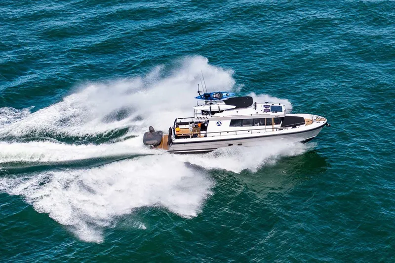 Slide: The Image of Aerial view of 2025 Targa 46 boat speeding on open water. - 2