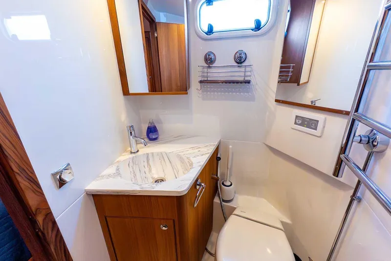 Slide: The Image of Luxurious bathroom in 2025 Targa 46 yacht with modern fixtures and elegant design. - 28