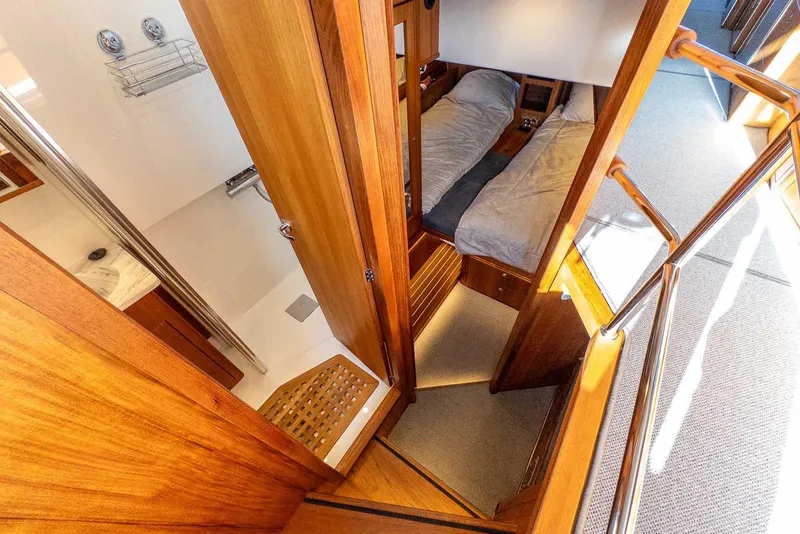 Slide: The Image of Interior of 2025 Targa 46 yacht featuring cozy cabin and modern bathroom. - 29