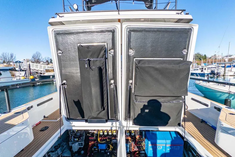 Slide: The Image of 2025 Targa 46 yacht with open engine compartment at marina. - 33