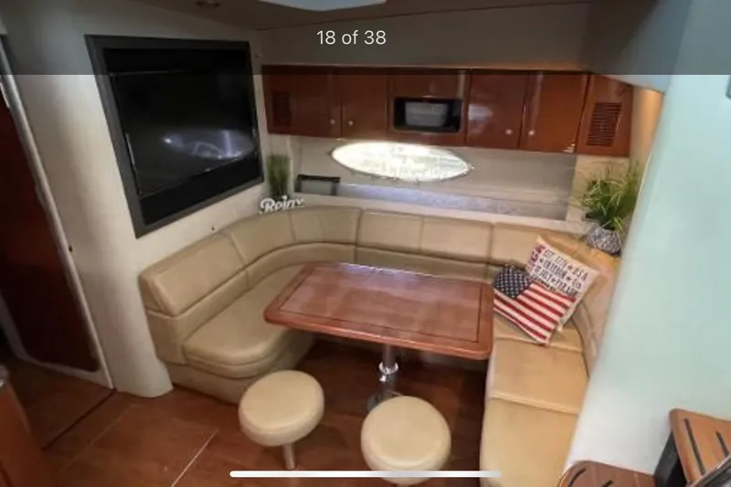 Slide: The Image of Interior of 2008 Formula 45 Yacht with cozy seating and wooden table. - 10