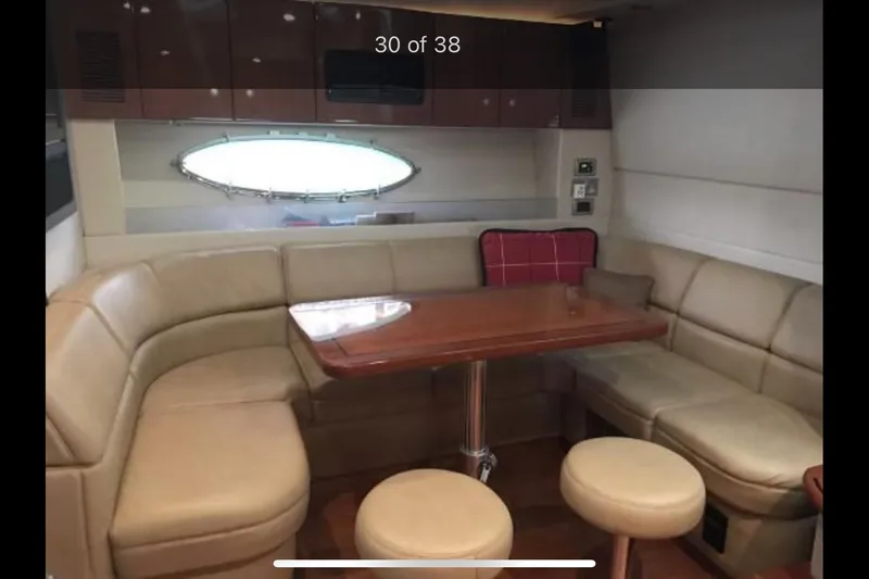Slide: The Image of 2008 Formula 45 Yacht interior with leather seating and wooden table. - 11