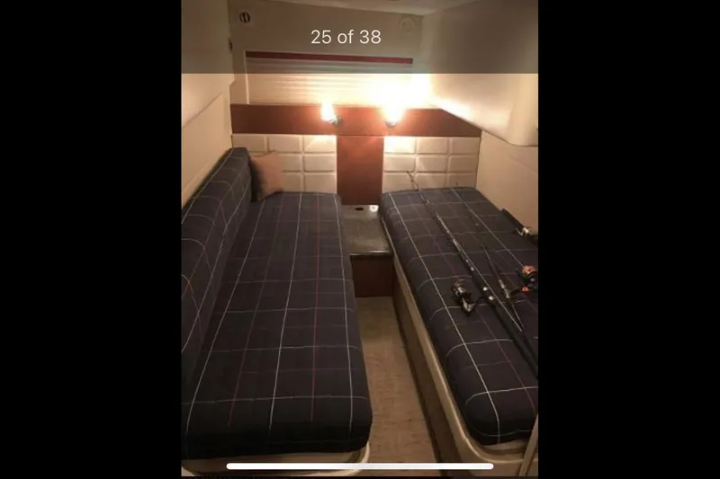 Slide: The Image of Interior of 2008 Formula 45 Yacht with twin beds and fishing rods. - 13