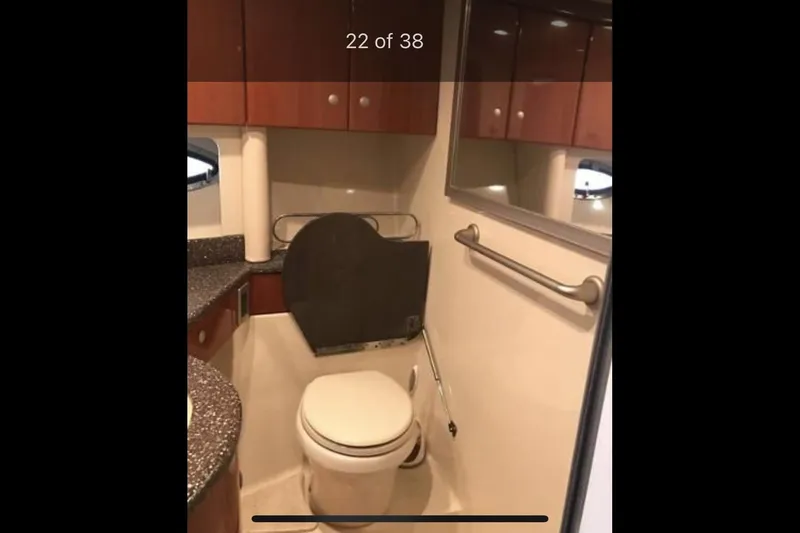 Slide: The Image of 2008 Formula 45 Yacht bathroom with wooden cabinets and modern fixtures. - 15