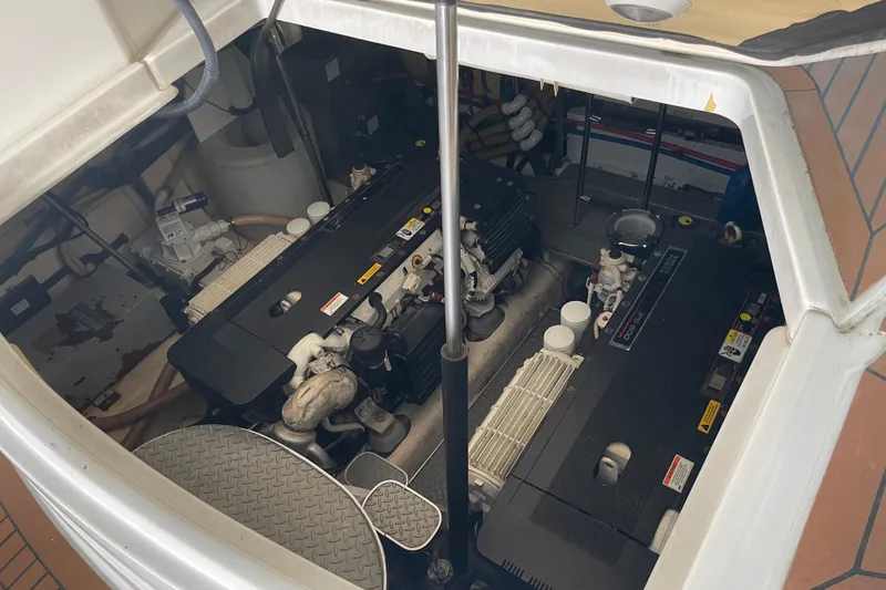 Slide: The Image of Engine compartment of a 2008 Formula 45 Yacht, showcasing dual engines and mechanical components. - 19