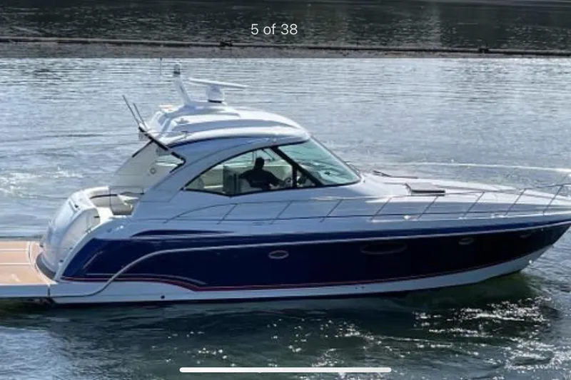 Slide: The Image of 2008 Formula 45 Yacht cruising on calm water, side view. - 2