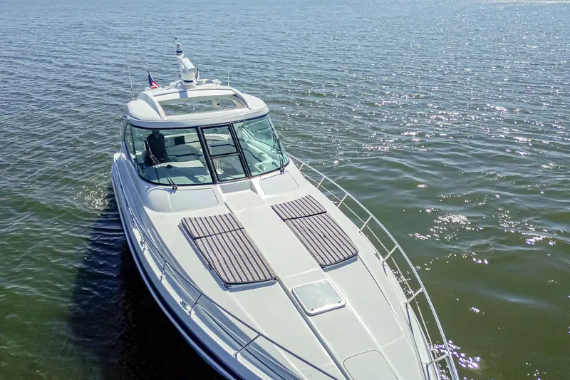 Slide: The Image of 2008 Formula 45 Yacht cruising on open water under clear skies. - 26