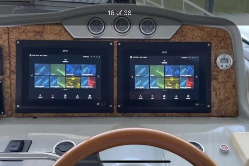 Slide: The Image of Dashboard of a 2008 Formula 45 Yacht with dual navigation screens. - 4