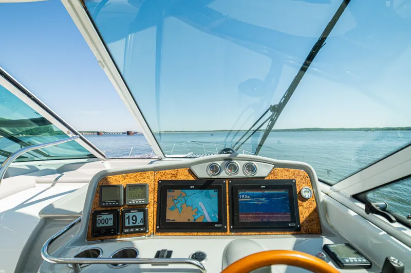 Slide: The Image of Cockpit view of 2008 Formula 45 Yacht with navigation screens and steering wheel. - 42