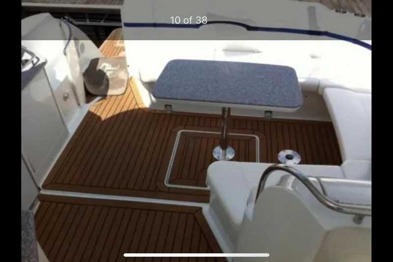 Slide: The Image of 2008 Formula 45 Yacht interior with wooden deck and seating area. - 6