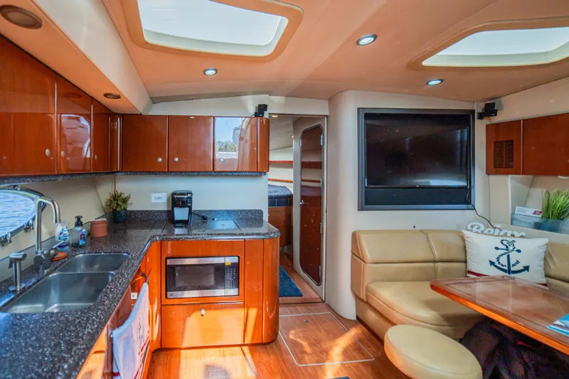 Slide: The Image of Luxurious interior of a 2008 Formula 45 Yacht with modern kitchen and cozy seating area. - 66