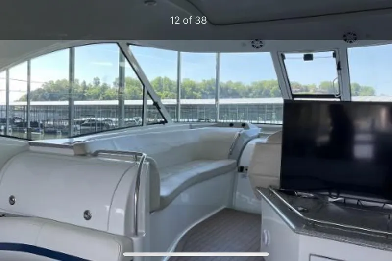 Slide: The Image of Interior of 2008 Formula 45 Yacht with seating and TV, docked in marina. - 7