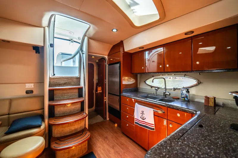 Slide: The Image of Luxurious interior of a 2008 Formula 45 Yacht with modern kitchen and elegant wood finishes. - 71