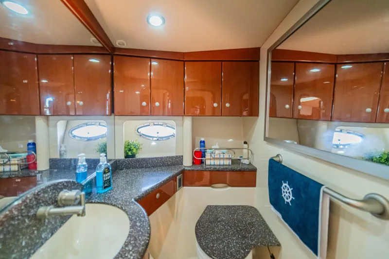 Slide: The Image of Luxurious bathroom interior of 2008 Formula 45 Yacht with elegant wood cabinetry and modern fixtures. - 87
