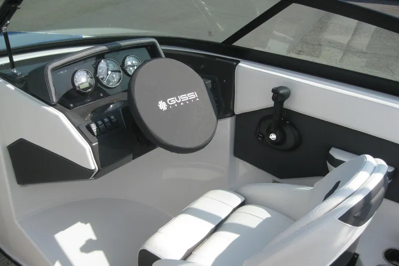 Slide: The Image of 2024 Monterey M-22 dashboard featuring a Fusion marine stereo system. - 13