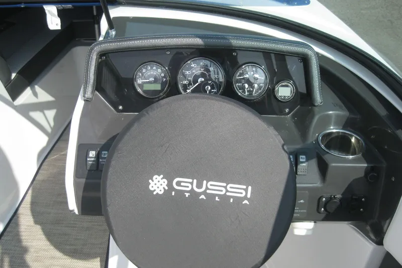 Slide: The Image of 2024 Monterey M-22 boat cockpit with Gussi Italia steering wheel and modern dashboard. - 14