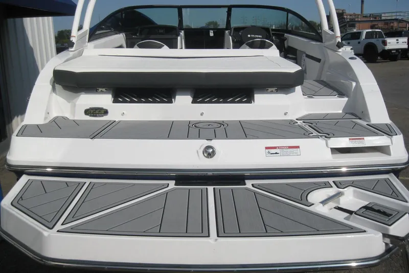 Slide: The Image of 2024 Monterey M-22 boat rear view with swim platform and seating area. - 3
