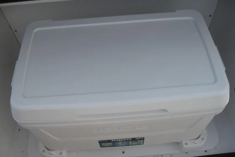 Slide: The Image of 2024 Monterey M-22 boat interior with white seating, speaker, and cup holders. - 8