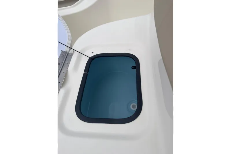 Slide: The Image of Open storage compartment on 2026 Bulls Bay 2000 boat, featuring a sleek design. - 18