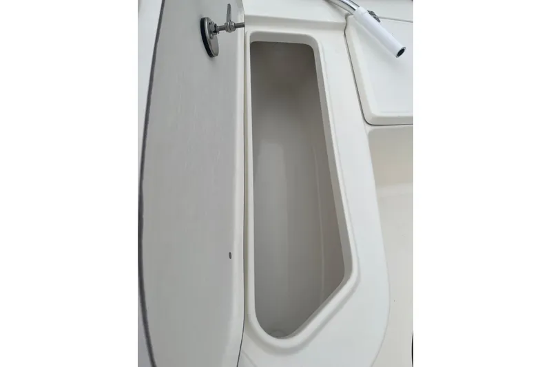 Slide: The Image of 2026 Bulls Bay 2000 boat interior compartment detail with white finish. - 22