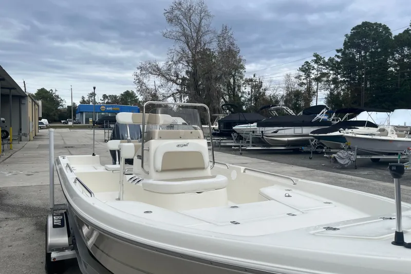 Slide: The Image of 2026 Bulls Bay 2000 boat in a marina with overcast sky. - 8