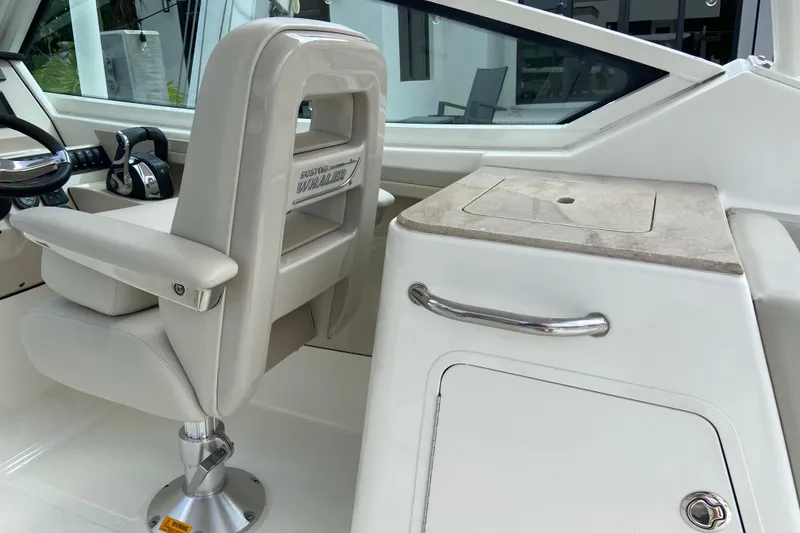 Slide: The Image of Interior of 2021 Boston Whaler 280 Vantage boat, featuring helm seat and console. - 13