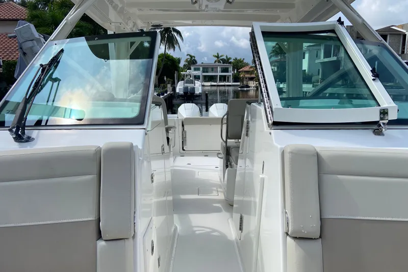 Slide: The Image of 2021 Boston Whaler 280 Vantage boat interior with open deck and waterfront view. - 21
