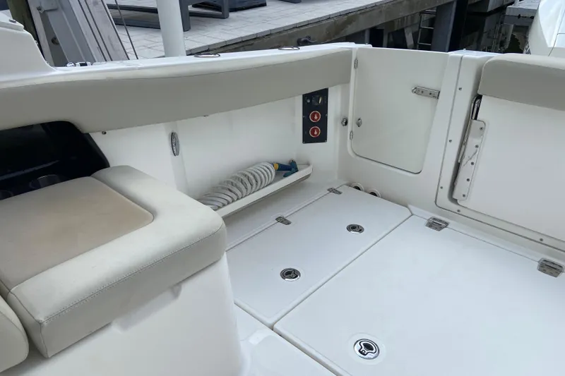 Slide: The Image of Interior view of 2021 Boston Whaler 280 Vantage boat, featuring seating and storage compartments. - 29