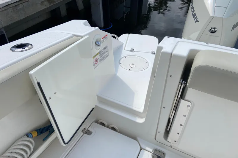 Slide: The Image of 2021 Boston Whaler 280 Vantage boat interior with open storage compartment. - 32