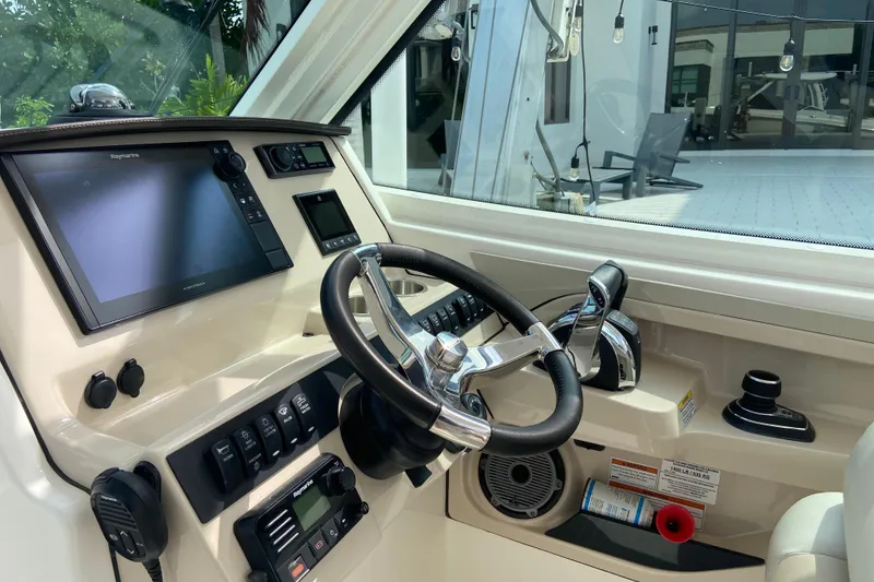 Slide: The Image of 2021 Boston Whaler 280 Vantage helm with modern controls and navigation system. - 33