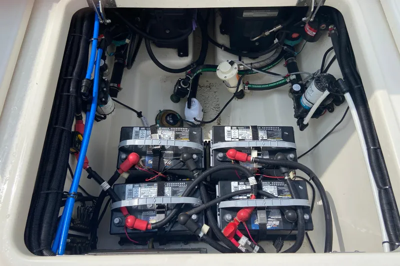 Slide: The Image of 2021 Boston Whaler 280 Vantage boat battery compartment with wiring and components. - 35