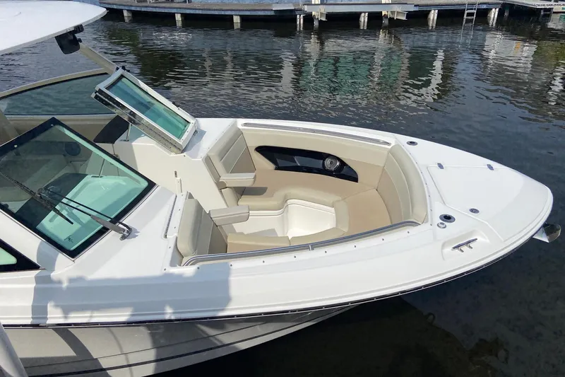 Slide: The Image of 2021 Boston Whaler 280 Vantage boat with open bow seating at a dock. - 39