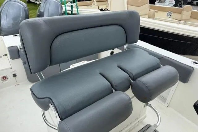 Slide: The Image of 2013 NauticStar 2500XS Offshore boat seat, gray upholstery, comfortable design. - 6
