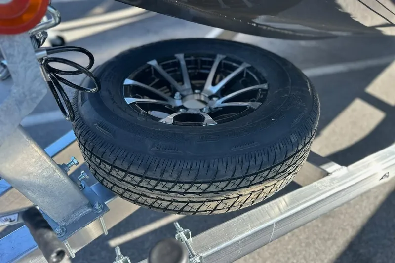 Slide: The Image of Spare tire mounted on a trailer for 2026 Avid 18 Commander boat. - 10