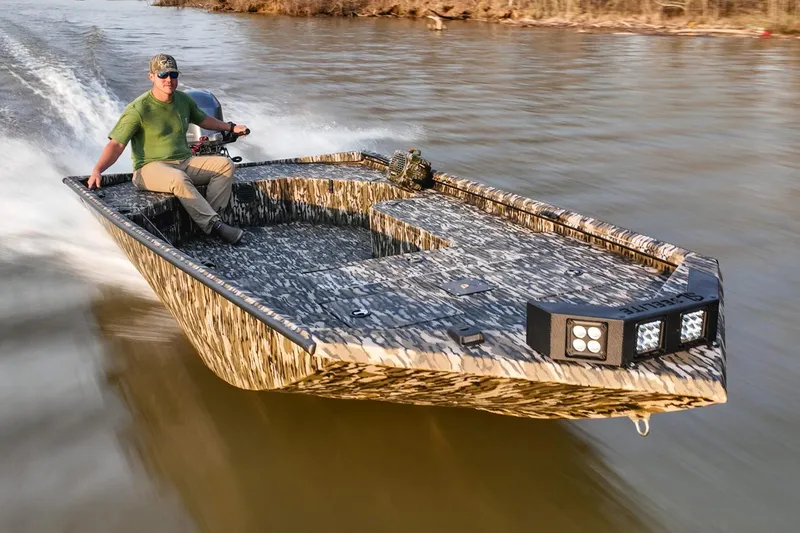 Slide: The Image of Manufacturer Provided Image: Avid 18 Commander 2026 boat cruising on a river. - 15