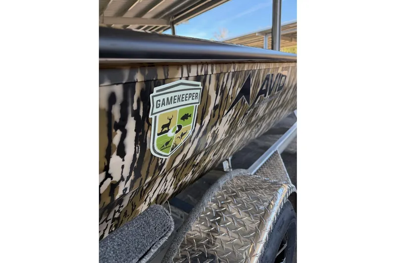 Slide: The Image of 2026 Avid 18 Commander boat with camouflage design and Gamekeeper logo. - 2