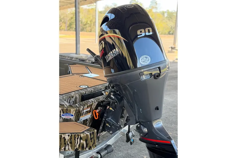 Slide: The Image of 2026 Avid 18 Commander boat with Yamaha 90 outboard motor, camo design. - 4