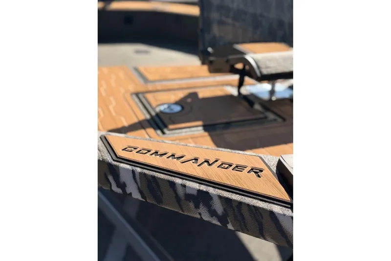 Slide: The Image of 2026 Avid 18 Commander boat deck with "Commander" branding in focus. - 8