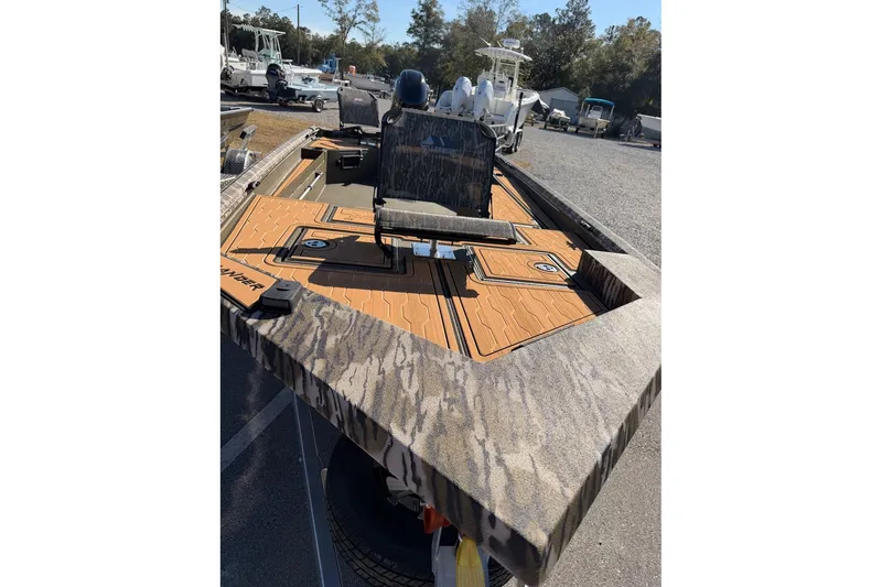 Slide: The Image of 2026 Avid 18 Commander boat with camo design and spacious deck. - 9